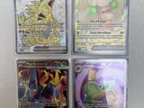 four different pokemon cards are sitting on a white surface