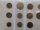 a lot of old coins in a plastic case