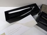 a box with a pair of scissors in it and a box with a pair of scissors in it
