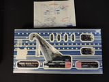 a box with a model of a crane and a piece of paper