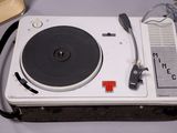 a turntable with a record player on top of it