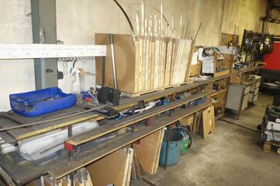 a workbench in a garage with a lot of tools on it