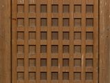 a wooden door with a lattice design on it