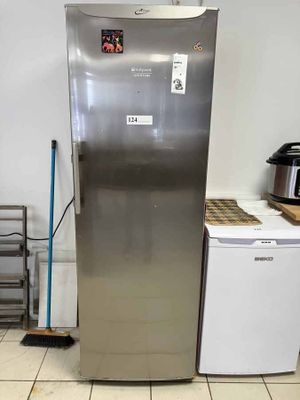 a stainless steel refrigerator in a kitchen with a small dishwasher next to it