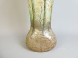a vase with a painting of trees on it