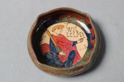 a small bowl with a picture of a man on it