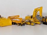 a lot of toy trucks that are lined up together