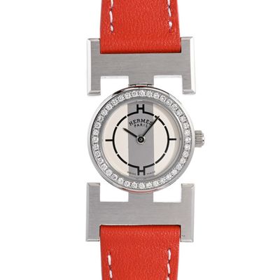 a close up of a watch on a white background with a red strap