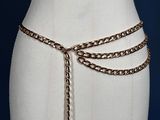 an image of a mannequin torso with a chain belt around it