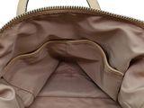 the inside of a tan and black purse with a zipper