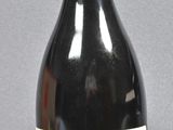 a bottle of wine that is sitting on a table