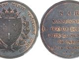 a close up of a coin with a crown on top of it