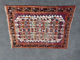 an old rug with a design on it on the floor