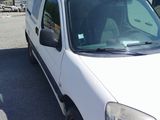 a picture of a white van parked in a parking lot