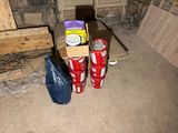 two cans of soda sitting on the floor in a room