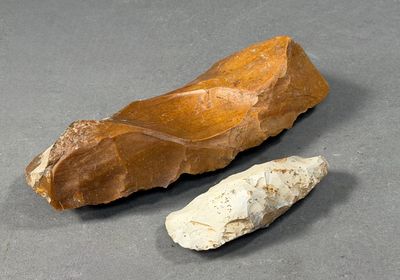 two pieces of stone on the table next to each other