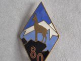 a close up of a badge with a goat on top of a mountain
