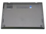 a close up of a laptop with a battery on top of it