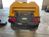 a back end of a yellow truck with a black tail light
