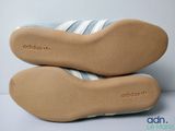 two pairs of adidas shoes are stacked on top of each other
