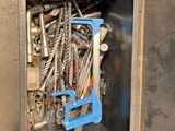 a metal box with a bunch of screws in it