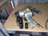 an image of a drill and other tools on a table