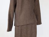 an image of a brown suit on a mannequin stand