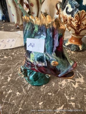two vases that are sitting on a table