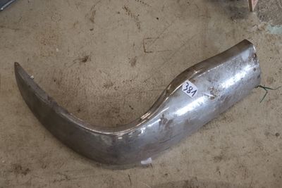 a piece of metal that is sitting on the ground