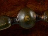 a close up of a metal object on a wooden table