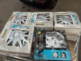 several boxes of assorted car parts sitting on top of a table