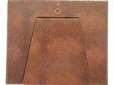 an image of a brown leather photo frame with a gold ring
