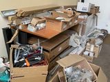 many boxes of assorted items sitting on the floor
