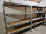 a room with a lot of shelvings and shelves in it