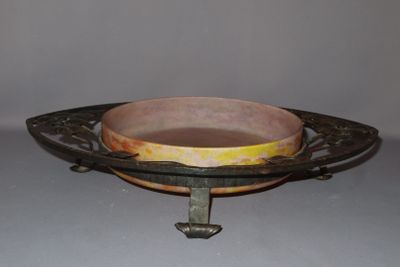 a bowl on a stand with a handle on it