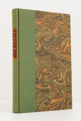 a book with a green cover sitting on top of a table