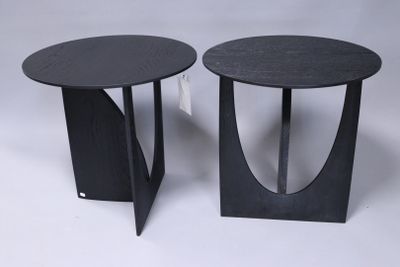 pair of black side tables with curved legs on a white background