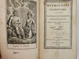an old book with a picture of a woman and a man sitting on top of it