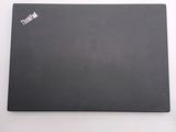 a black mouse pad with a red sticker on it