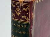 an old book that is sitting on top of a table