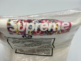 someone is holding a bag of candy with the word supreme on it