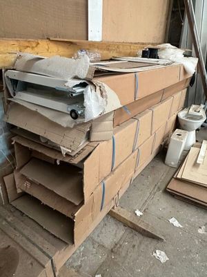 a pile of cardboard boxes stacked on top of each other