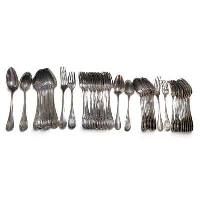 many forks and spoons arranged in a row on a white surface
