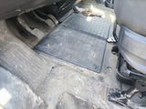 a dirty floor in the back of a car