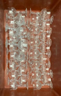 bottles of water are lined up in a box on a table