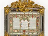 an ornate gold frame with a picture of a man holding a book