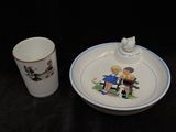 a cup and saucer sitting next to each other on a table