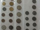 a lot of coins that are in a plastic container