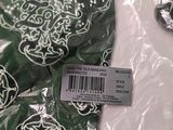 a close up of a green bandana with a barcode on it