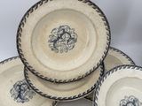 three blue and white plates with designs on them sitting on a table